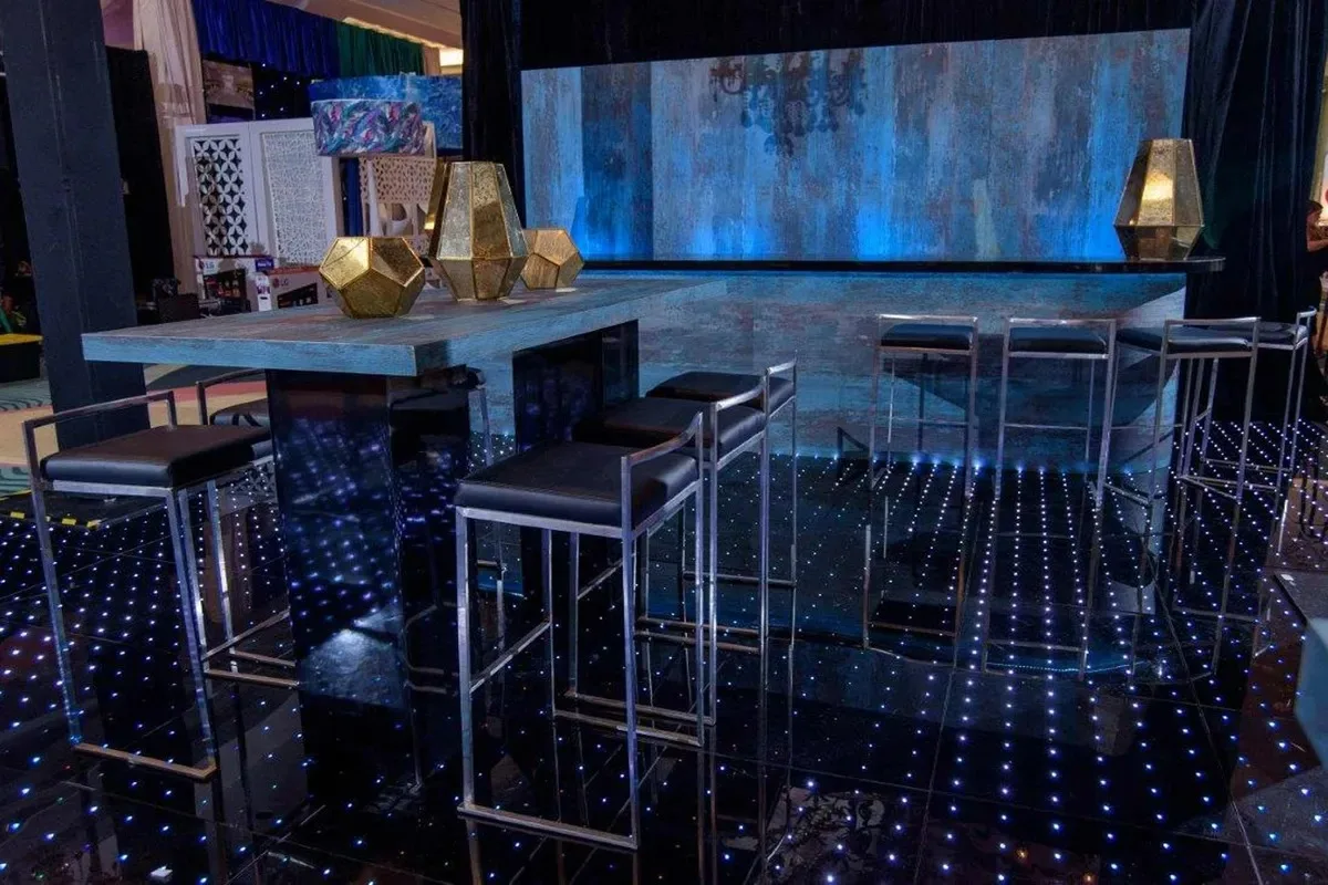 Malta Bar Stool - Black 16.25”L x 17.75”W x 34”H Seat Height_ 31.5” Shown w_ Blue Oxygen Communal High Top Table in Pompano Beach, Florida